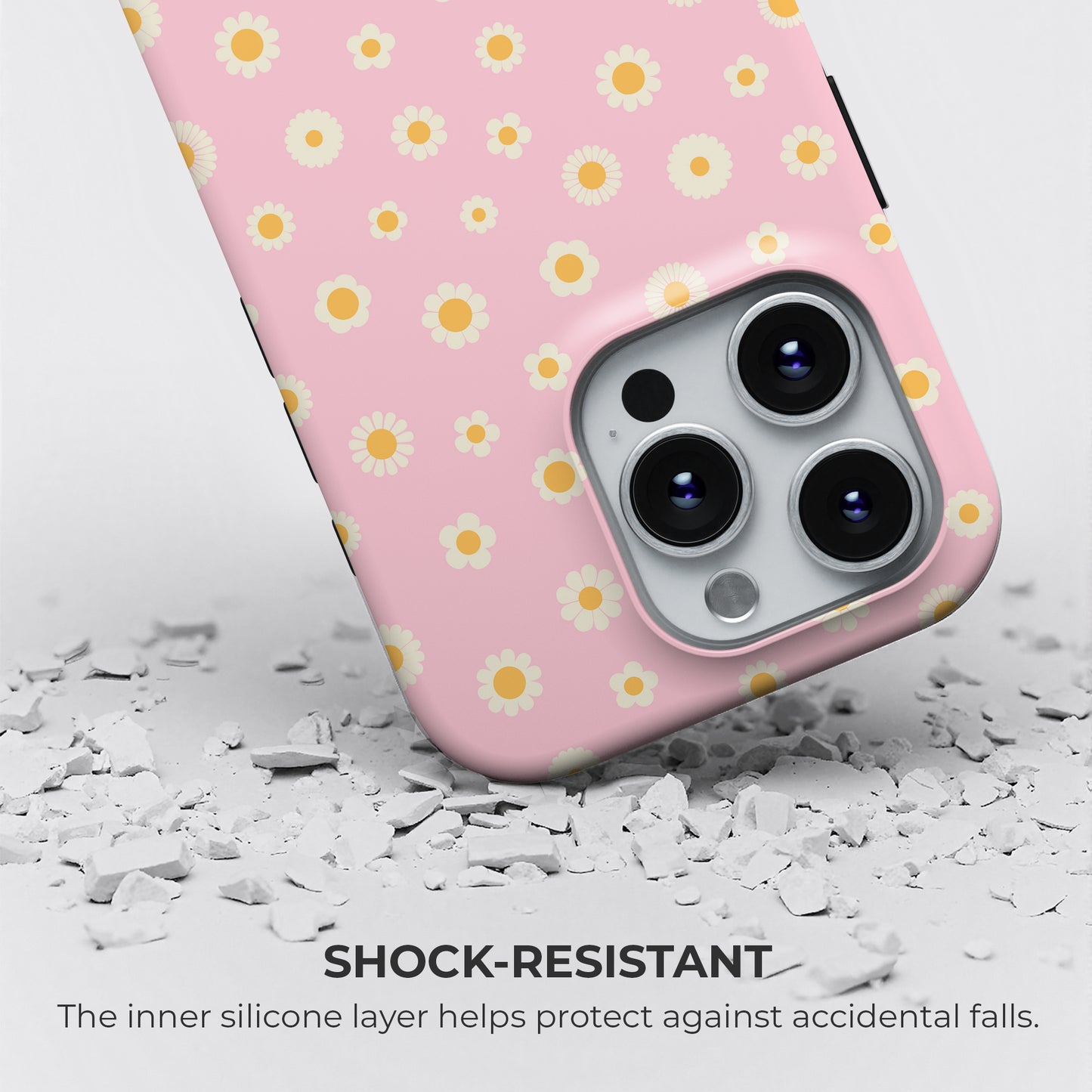 Shock-resistant pink iPhone tough case with white and yellow daisy floral pattern, silicone layer for drop protection by HaloCovers