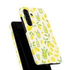a phone case with a yellow and green lemon pattern.