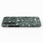 a rectangular phone case with a green and white speckled pattern.