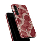 a phone case with a floral pattern, specifically a design of red flowers.