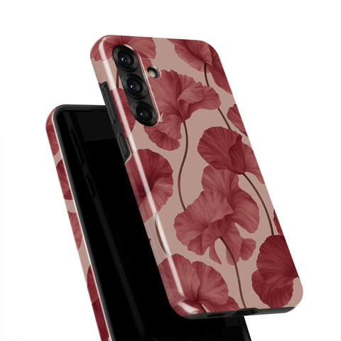 a phone case with a floral pattern, specifically a design of red flowers.