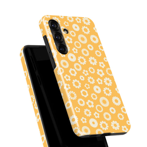 a phone case with a yellow floral pattern.