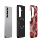 three different phone cases, each with a unique design and color.