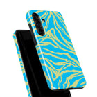 a phone case with a vibrant, zebra-like pattern in shades of blue and yellow.
