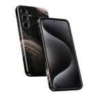 a black smartphone with a marble-like pattern on its back cover.