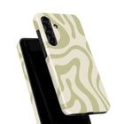 a phone case with a wavy pattern in shades of green and white.