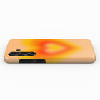 a smartphone case with a vibrant, gradient design featuring a warm orange and yellow color scheme.