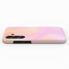 A pink and peach gradient smartphone case is shown against a white background.