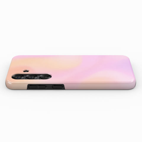 A pink and peach gradient smartphone case is shown against a white background.
