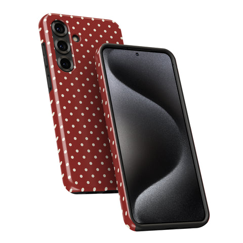 a red and white polka dot pattern on a smartphone case.