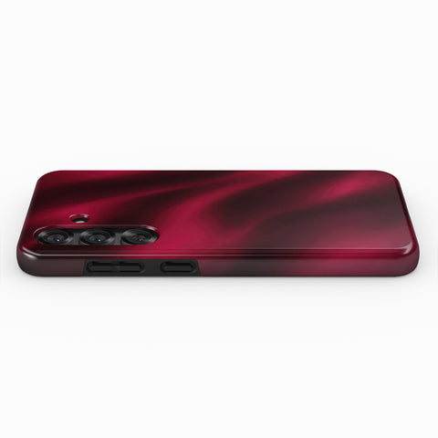 A red-colored smartphone case with a wavy texture, placed on a white background.