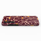 A smartphone case with a floral pattern in shades of burgundy and orange.