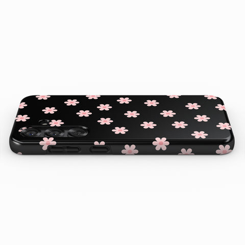 A black phone case with a pattern of pink flowers on it.