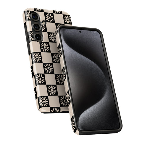 a smartphone with a black and white checkered pattern on its back cover and a black screen.