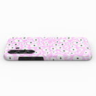 A pink and white floral pattern on a phone case.