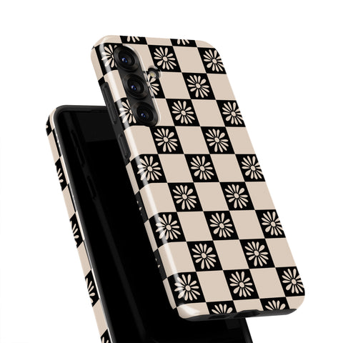 a phone case with a black and white checkered pattern.
