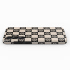 A black and white checkered pattern on a surface.