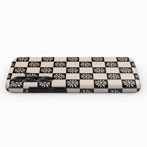 A black and white checkered pattern on a surface.
