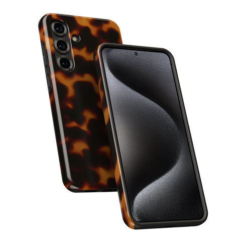 a smartphone with a tortoiseshell pattern on its back cover and a black screen.