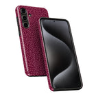 a smartphone with a pink dotted pattern on its back cover and a black screen.