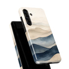 a phone case with a watercolor-style design depicting a landscape with mountains and water.