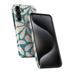 a smartphone with a floral patterned case on the back and a black screen on the front.
