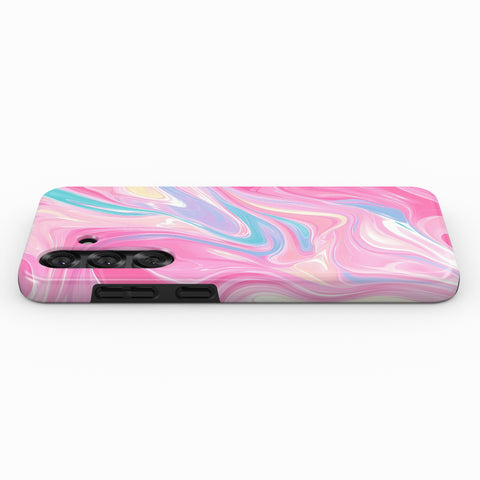 a pink and blue marble-like pattern on a surface.