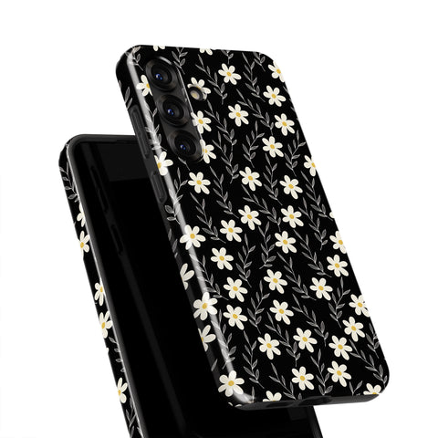 a black phone case with a white floral pattern on it.
