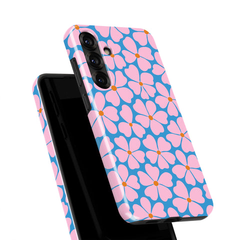 a phone case with a floral pattern in shades of pink and blue.