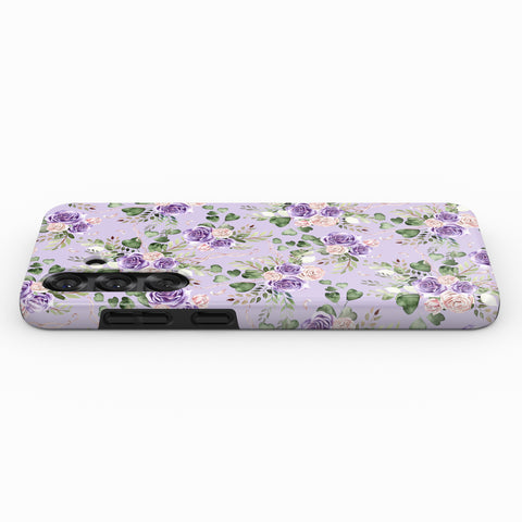 a phone case with a floral pattern in shades of purple and green.