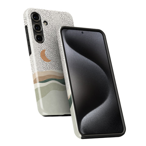 a smartphone case with a pattern of dots and a crescent moon design. The case is black and has a curved shape, which is designed to fit the phone.