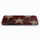 A burgundy-colored phone case with a leopard print star design on it.