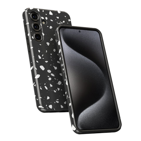 a black smartphone with a speckled pattern on its back cover.