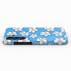 A blue phone case with a pattern of white flowers on it.