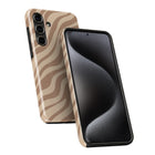 a smartphone with a zebra print case on it.