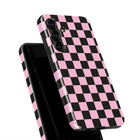 a phone case with a pink and black checkered pattern.