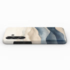 a phone case with a colorful abstract design featuring curved lines in shades of blue, beige, and gray.