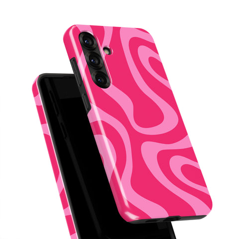 A pink and black phone case with a repeating pattern of swirls and curves.