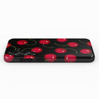 a black phone case with a repeating pattern of red cherries on a black background.