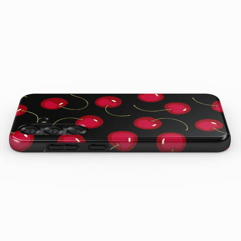 a black phone case with a repeating pattern of red cherries on a black background.