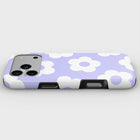 A phone case with a purple and white flower pattern.