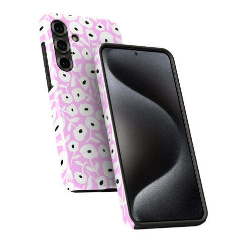 a pink and white floral pattern on the back of a smartphone case, with the case facing the camera.
