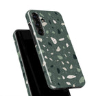 a phone case with a green and white speckled pattern.
