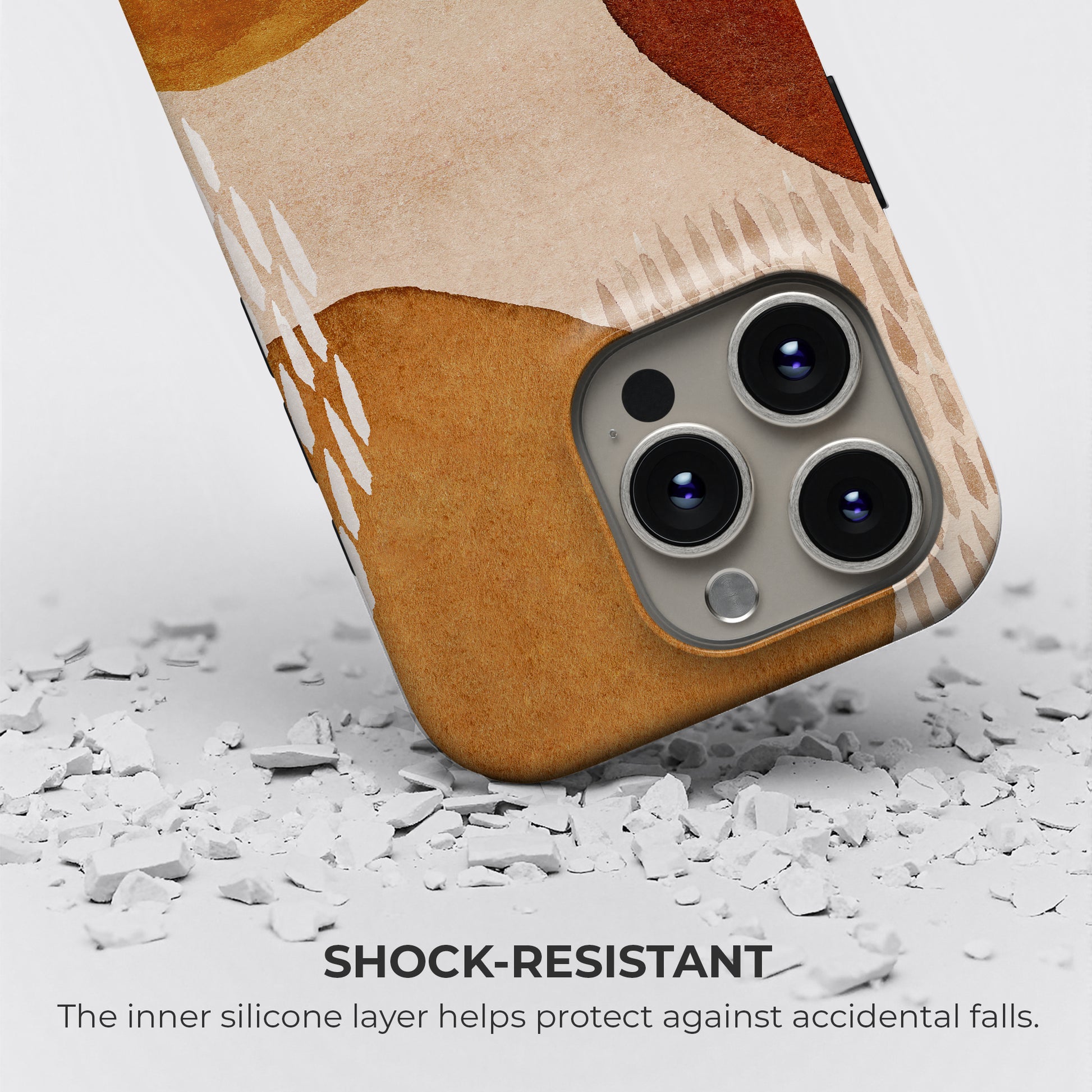 Abstract mustard and terracotta tough phone case showing shock-resistant protection with inner silicone layer guarding against accidental drops