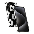 a smartphone case with a black and white floral pattern.