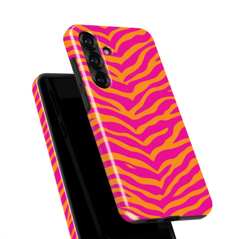 a phone case with a vibrant zebra print design in shades of pink and orange.