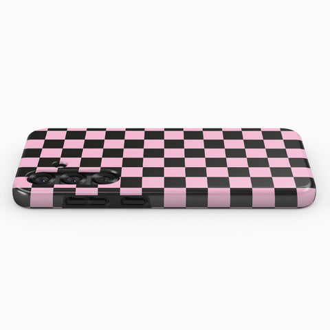A pink and black checkered pattern on a phone case.