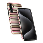 a smartphone with a colorful striped case on it.