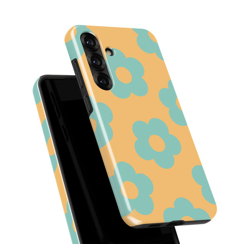 a colorful phone case with a floral pattern in shades of yellow and blue.