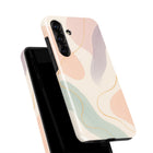 a phone case with a colorful abstract design, including shades of pink, green, and blue. The case appears to be a stylish and eye-catching accessory for a smartphone.